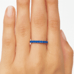 Blue sapphire eternity ring Hand