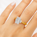 Emerald cut Trilogy ring Hand