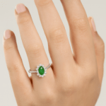 Emerald ring in Diana setting Hand