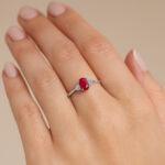 Oval Ruby ring with side diamonds Hand