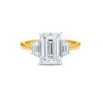 Emerald cut trilogy engagement ring