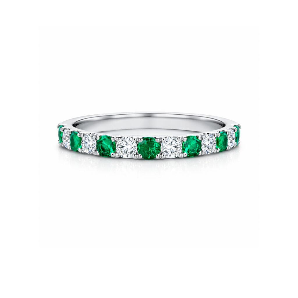 Eternity ring with emeralds and diamonds