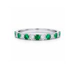 Eternity ring with emeralds and diamonds
