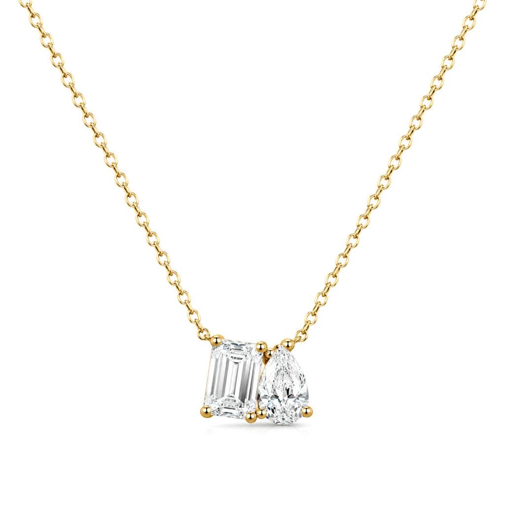 Emerald and pear diamond pendant