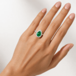 Pear shaped green emerald ring with halo Dubai