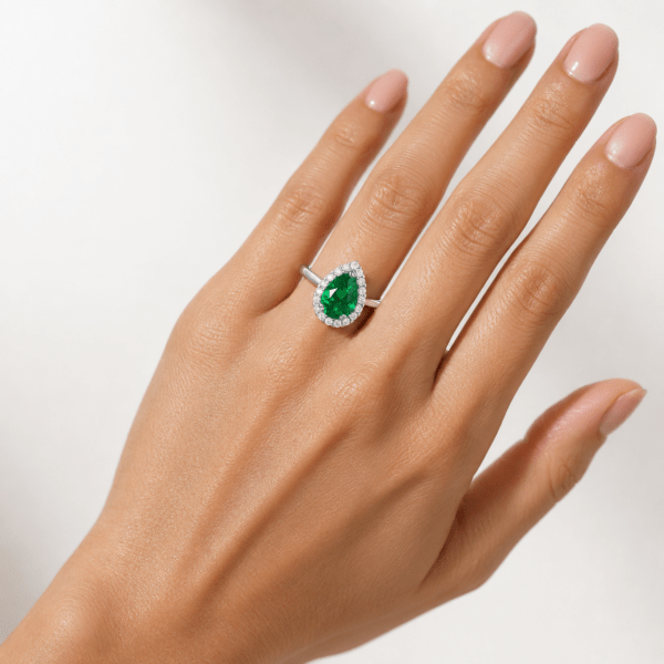 Pear shaped green emerald ring with halo Dubai