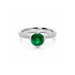Round emerald ring with side diamonds