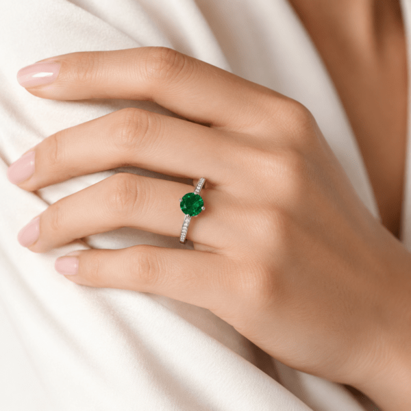 Round emerald ring with side diamonds Dubai